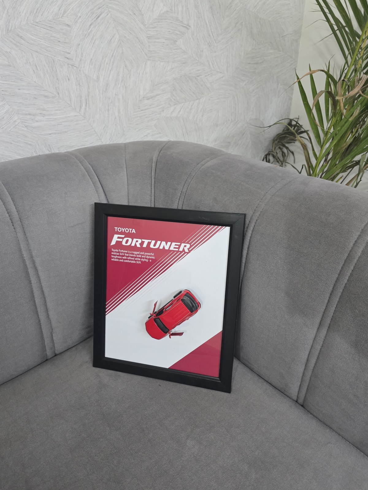 Toyota Fortuner in Red — scale model in a shadow-box frame with an engraved plaque