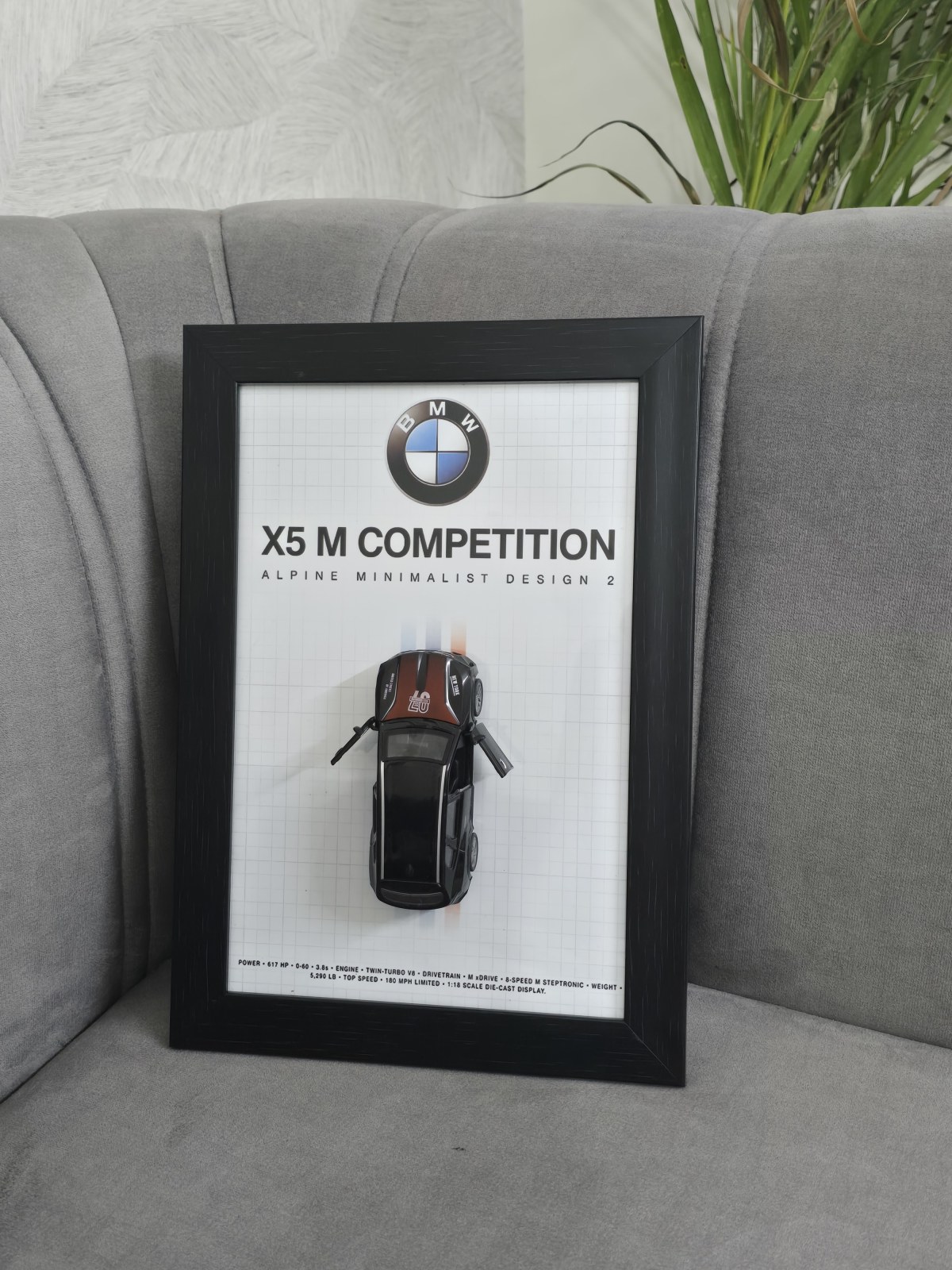 BMW X5 M in Black — scale model in a shadow-box frame with an engraved plaque